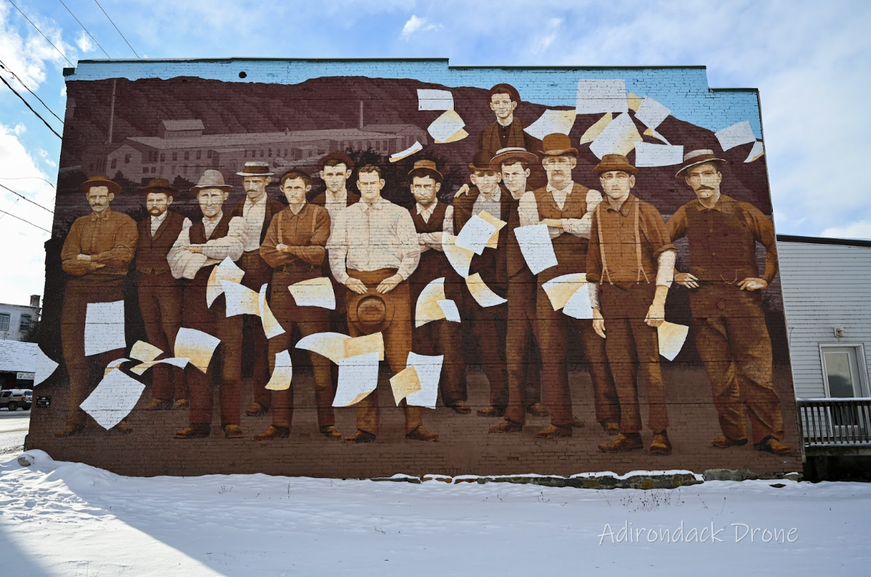 downtown ticonderoga mural of working men